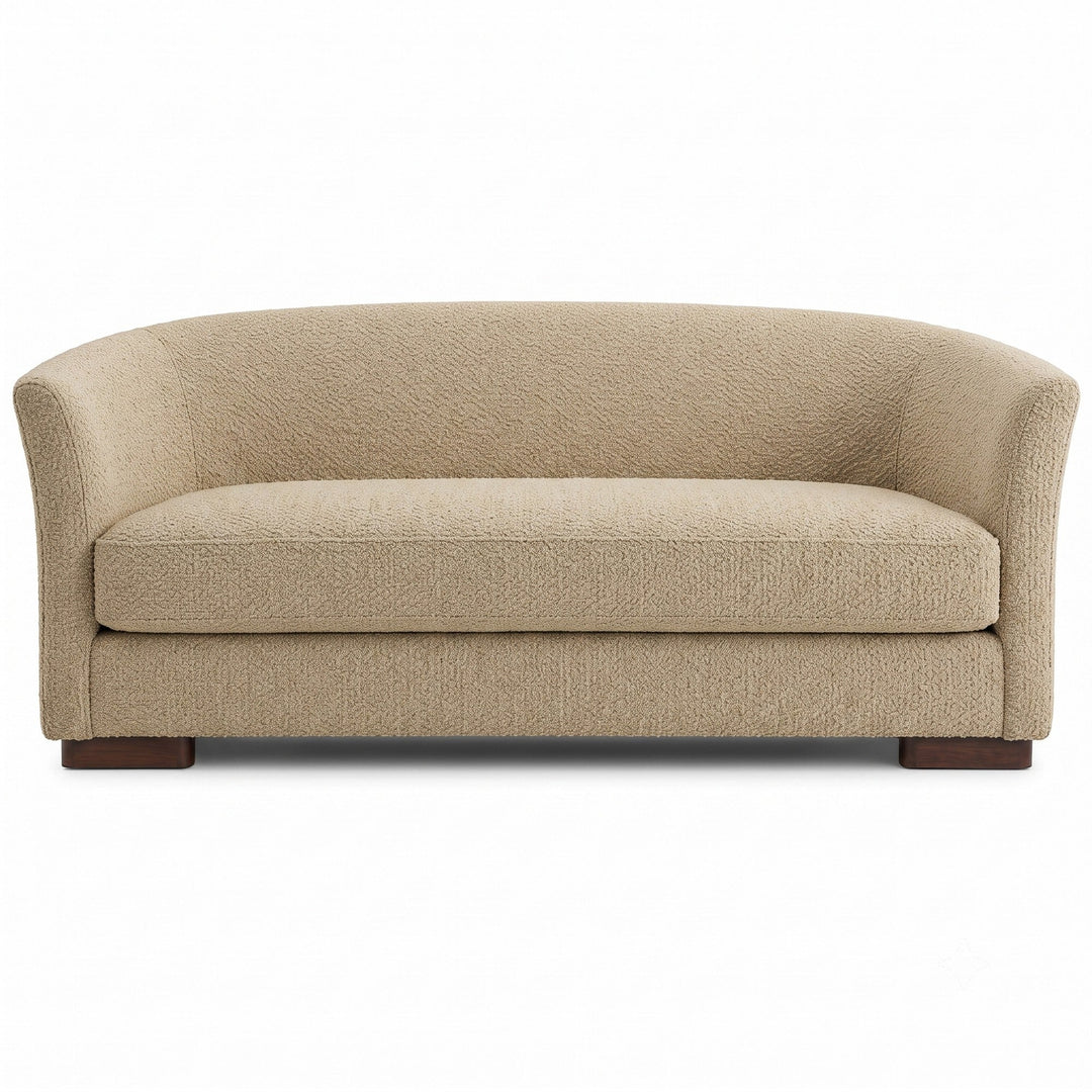 Castro Fabric in color Beige made on a sofa is a Solid Bouclé Fabric that is good for Drapery & Curtain Fabric and Upholstery Fabric