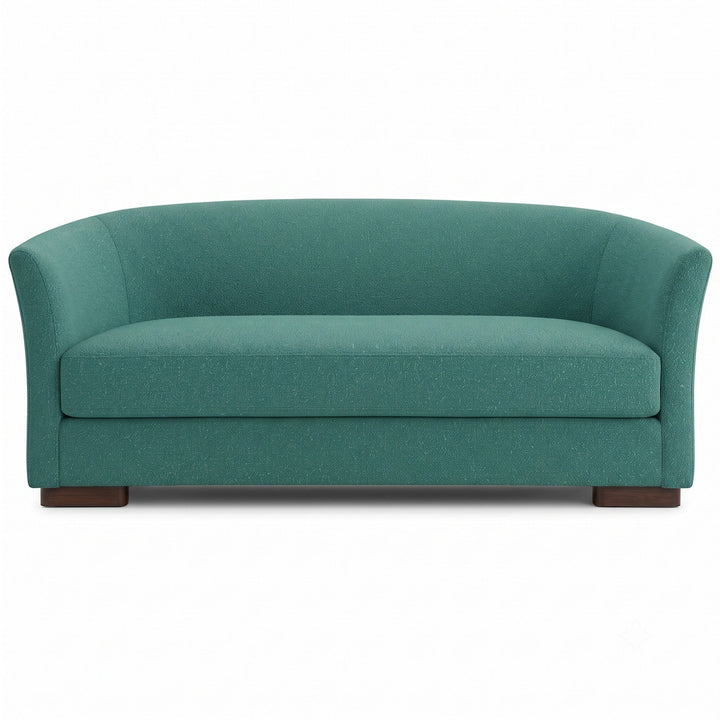 Castro Fabric in color Teal made on a sofa is a Solid Bouclé Fabric that is good for Drapery & Curtain Fabric and Upholstery Fabric