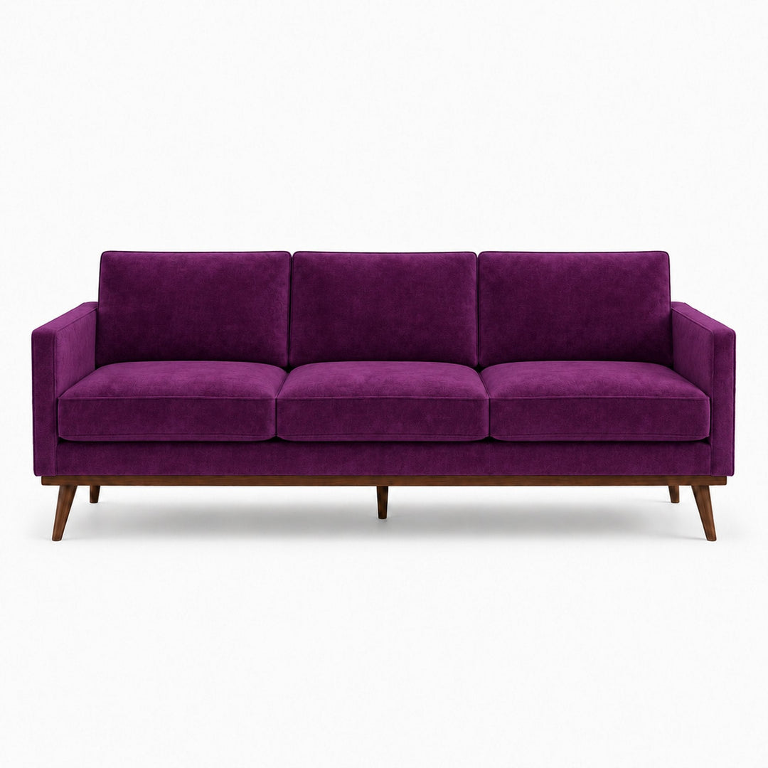 Gian Fabric in color Aubergine made on a sofa is a Solid Shiny Velvet Fabric that is good for Drapery & Curtain Fabric and Upholstery Fabric