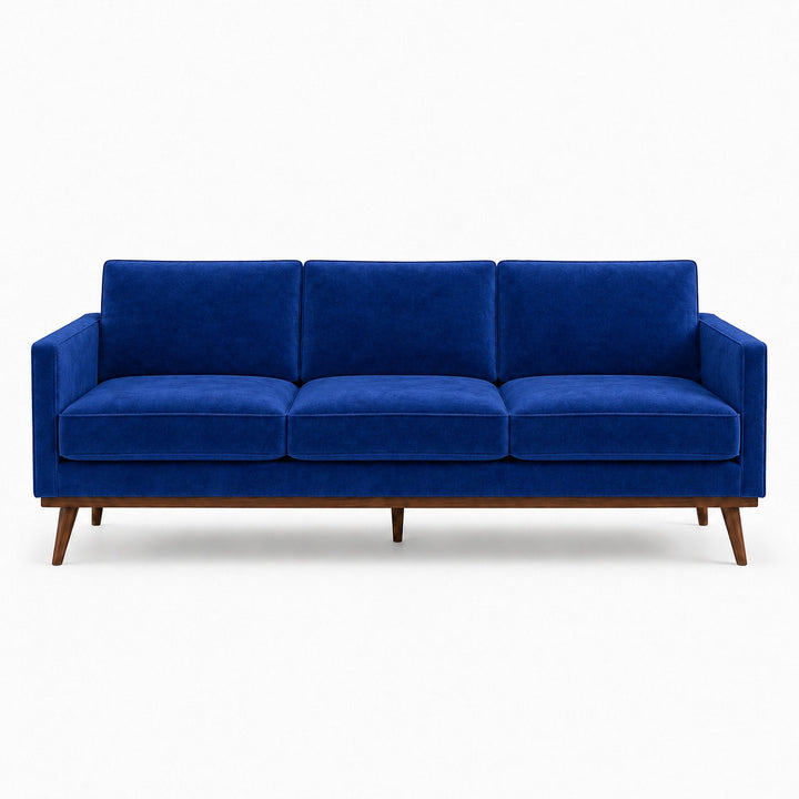 Gian Fabric in color Indigo made on a sofa is a Solid Shiny Velvet Fabric that is good for Drapery & Curtain Fabric and Upholstery Fabric