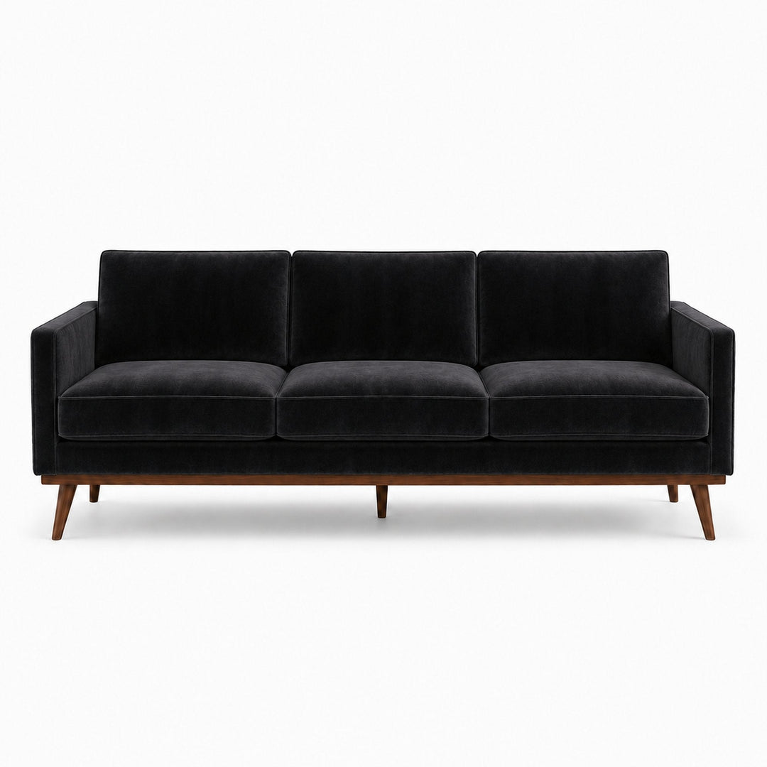 Gian Fabric in color Black made on a sofa is a Solid Shiny Velvet Fabric that is good for Drapery & Curtain Fabric and Upholstery Fabric