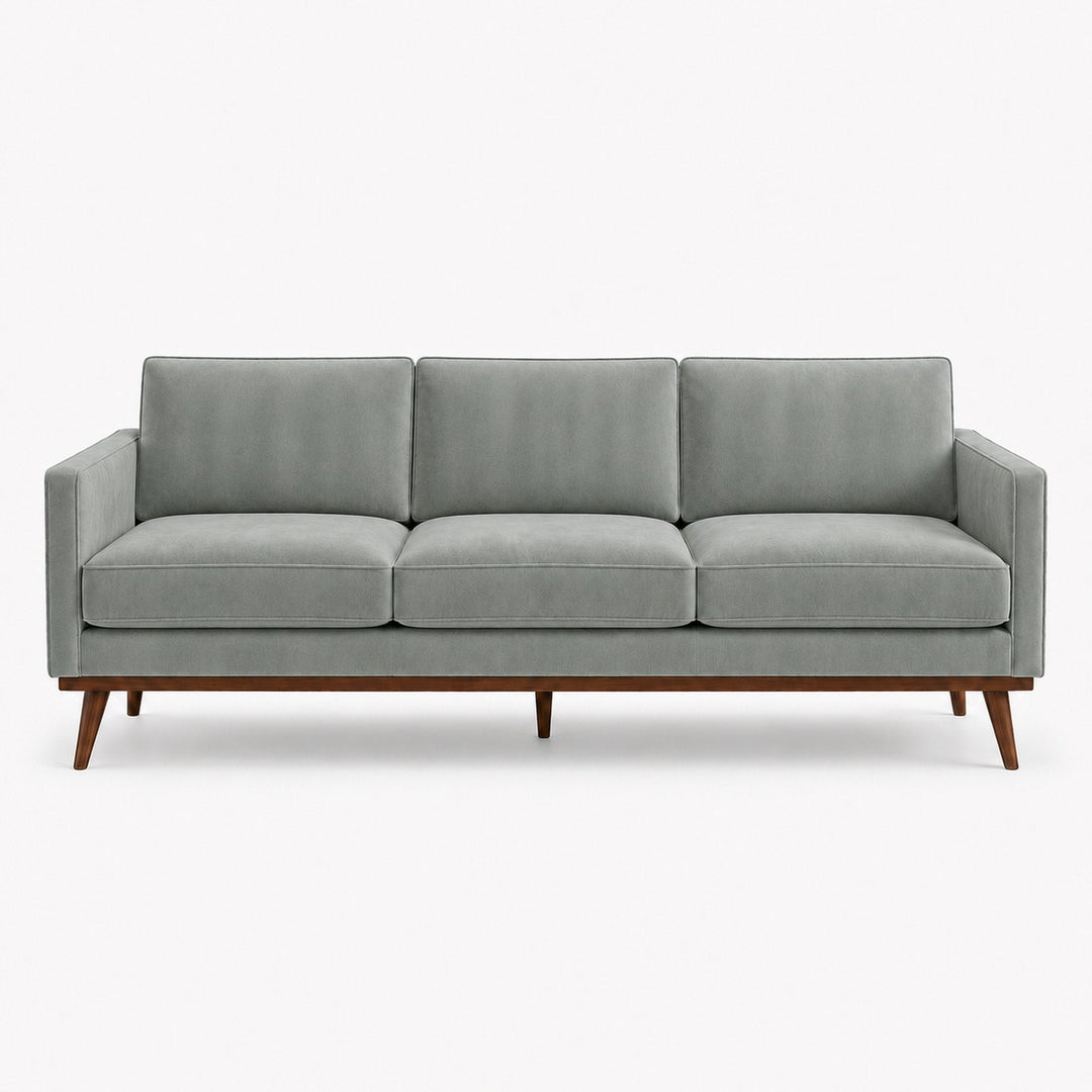Gian Fabric in color Sky made on a sofa is a Solid Shiny Velvet Fabric that is good for Drapery & Curtain Fabric and Upholstery Fabric