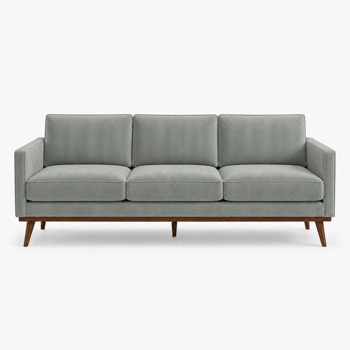 Gian Fabric in color Sky made on a sofa is a Solid Shiny Velvet Fabric that is good for Drapery & Curtain Fabric and Upholstery Fabric