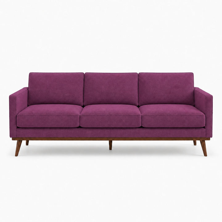 Gian Fabric in color Orchid made on a sofa is a Solid Shiny Velvet Fabric that is good for Drapery & Curtain Fabric and Upholstery Fabric