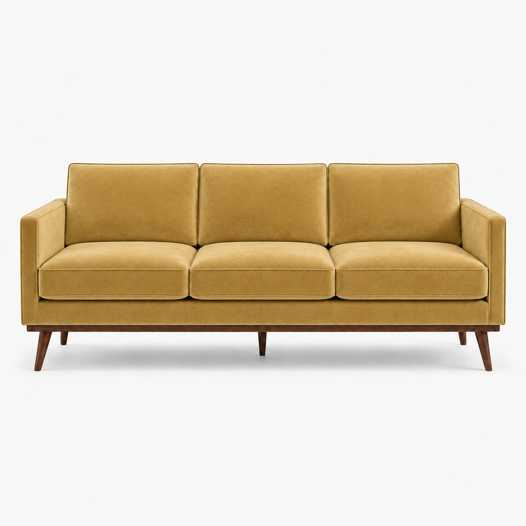Gian Fabric in color Gold made on a sofa is a Solid Shiny Velvet Fabric that is good for Drapery & Curtain Fabric and Upholstery Fabric