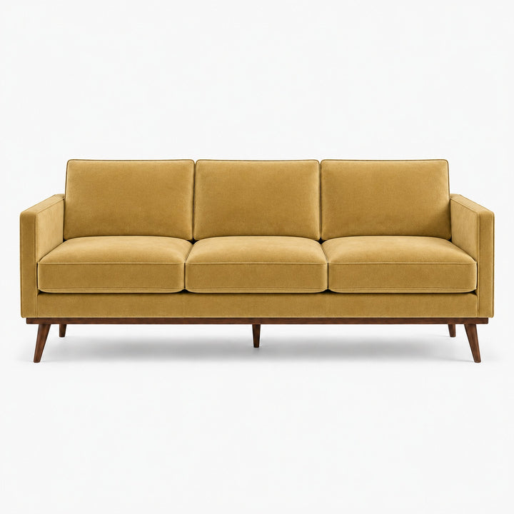 Gian Fabric in color Gold made on a sofa is a Solid Shiny Velvet Fabric that is good for Drapery & Curtain Fabric and Upholstery Fabric
