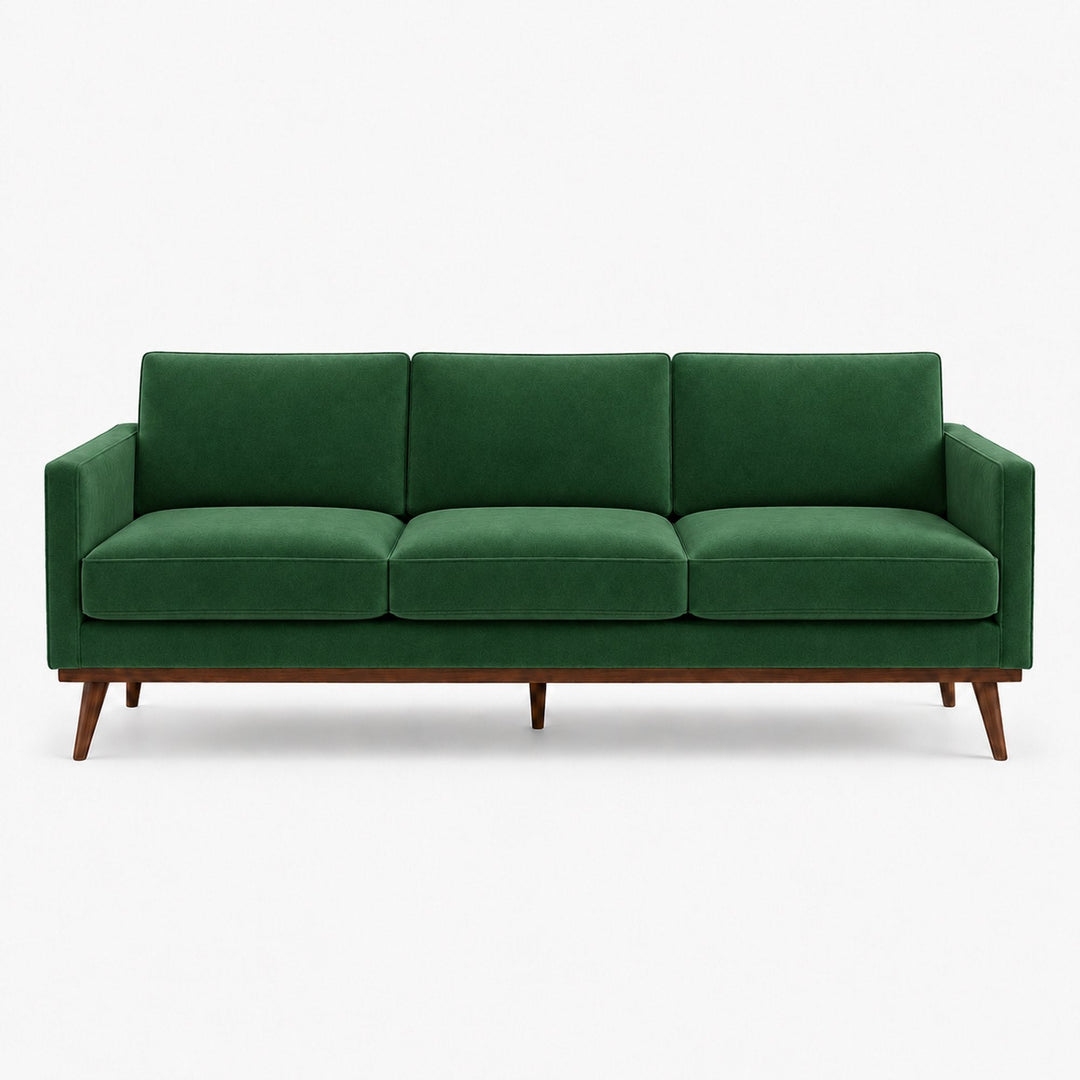 Gian Fabric in color Emerald made on a sofa is a Solid Shiny Velvet Fabric that is good for Drapery & Curtain Fabric and Upholstery Fabric