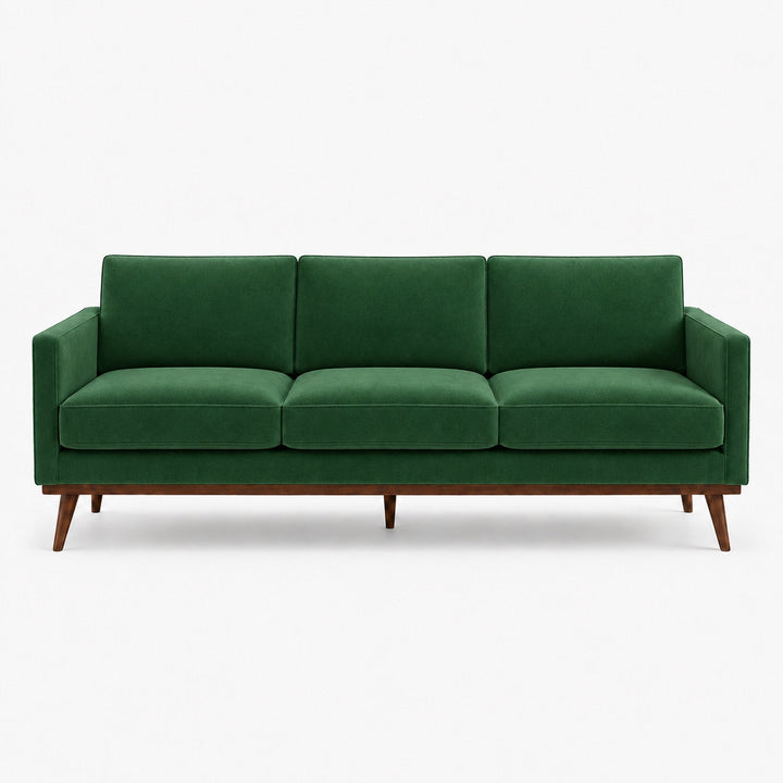 Gian Fabric in color Emerald made on a sofa is a Solid Shiny Velvet Fabric that is good for Drapery & Curtain Fabric and Upholstery Fabric