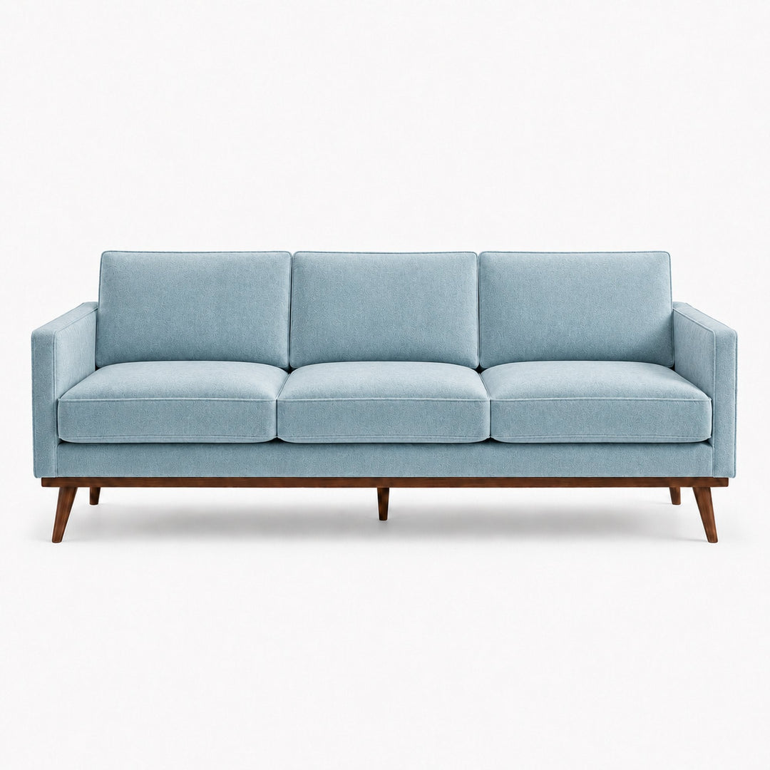 Gian Fabric in color Azure made on a sofa is a Solid Shiny Velvet Fabric that is good for Drapery & Curtain Fabric and Upholstery Fabric