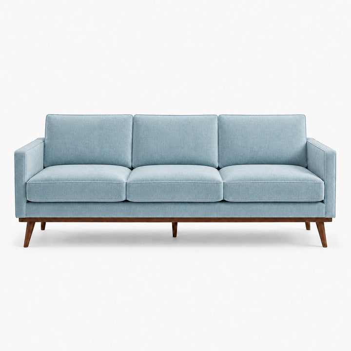 Gian Fabric in color Azure made on a sofa is a Solid Shiny Velvet Fabric that is good for Drapery & Curtain Fabric and Upholstery Fabric