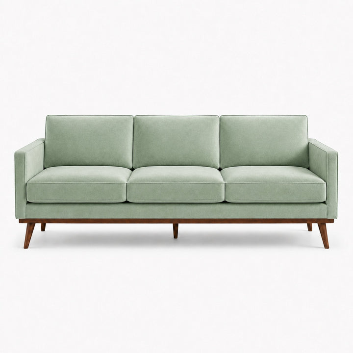 Gian Fabric in color Teal made on a sofa is a Solid Shiny Velvet Fabric that is good for Drapery & Curtain Fabric and Upholstery Fabric