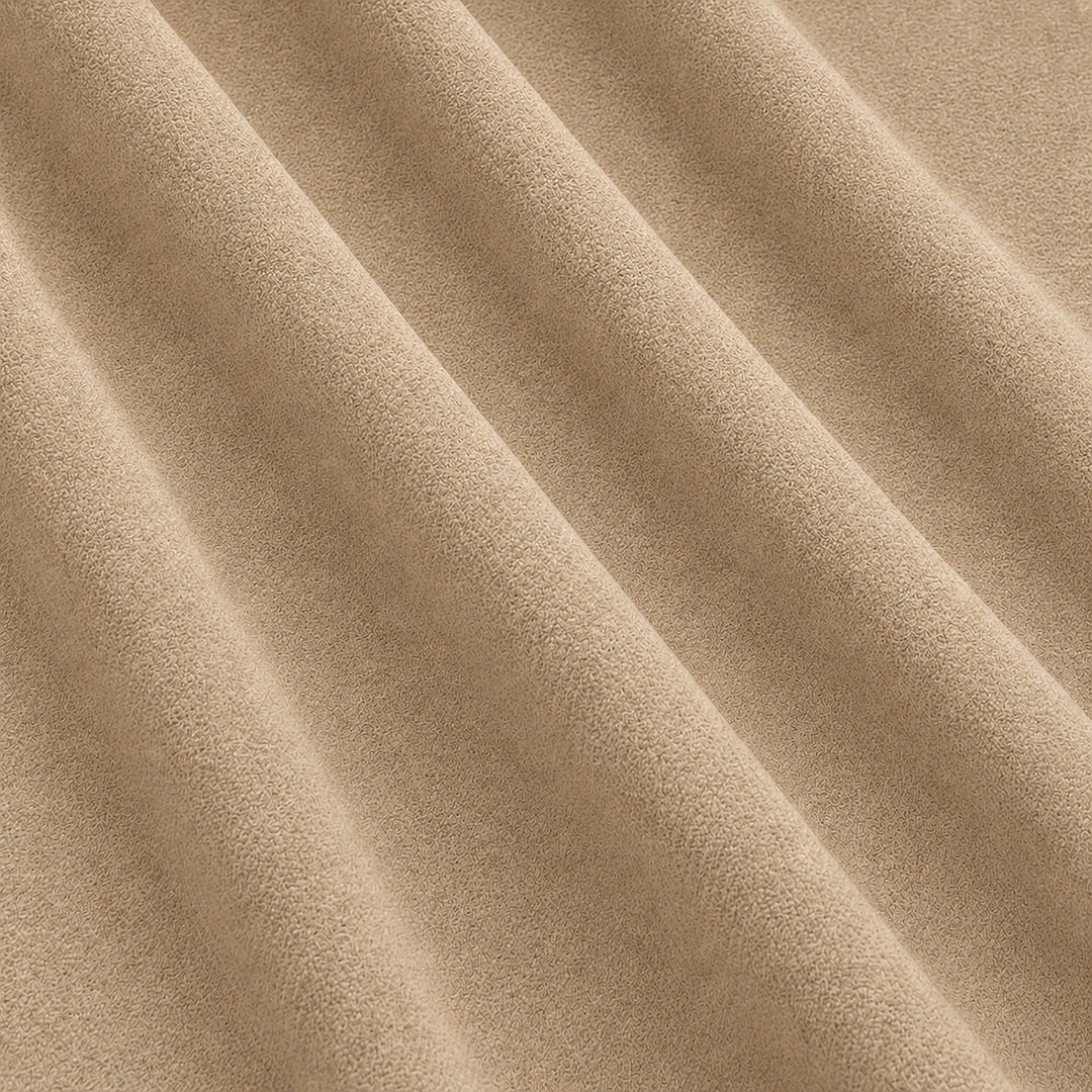 Gian Fabric in color Champagne that has a wavy look is a Solid Shiny Velvet Fabric that is good for Drapery & Curtain Fabric and Upholstery Fabric