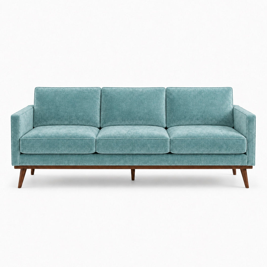 Gian Fabric in color Turquoise made on a sofa is a Solid Shiny Velvet Fabric that is good for Drapery & Curtain Fabric and Upholstery Fabric