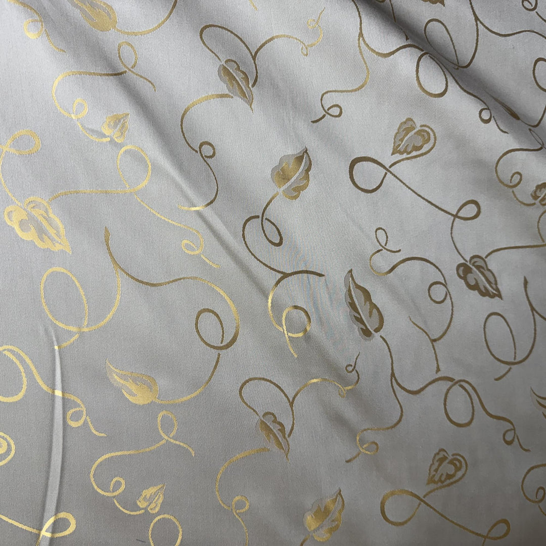 Ravelline Metallic Base Abstract Leaves Silk Fabric in Platinum