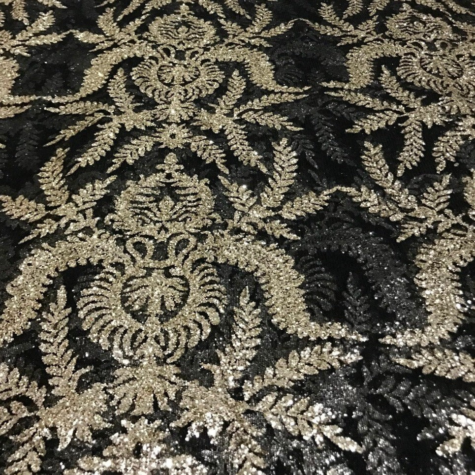 Tessuto per abiti da festa di nozze in pizzo a rete con paillettes ricamate in rilievo e oro nero Olympe Regal da 5 metri